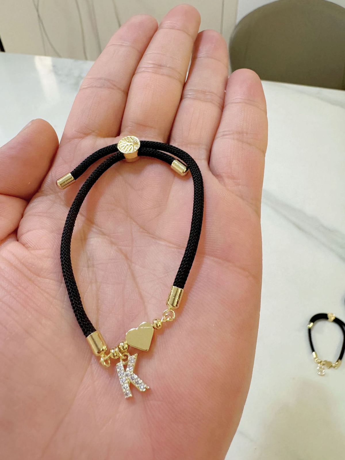 Black initial rope bracelet, letter K
