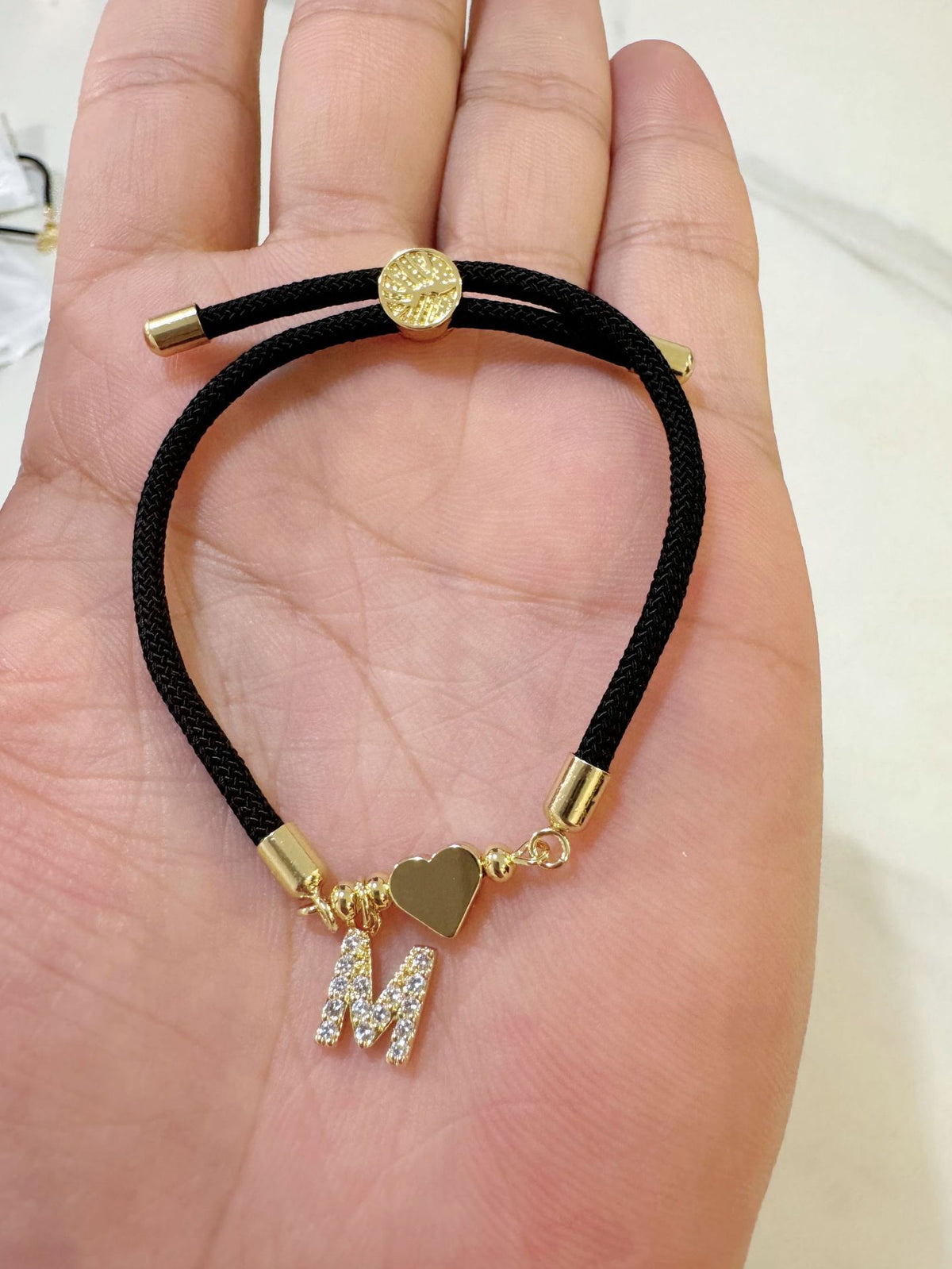 Black initial rope bracelet, letter M