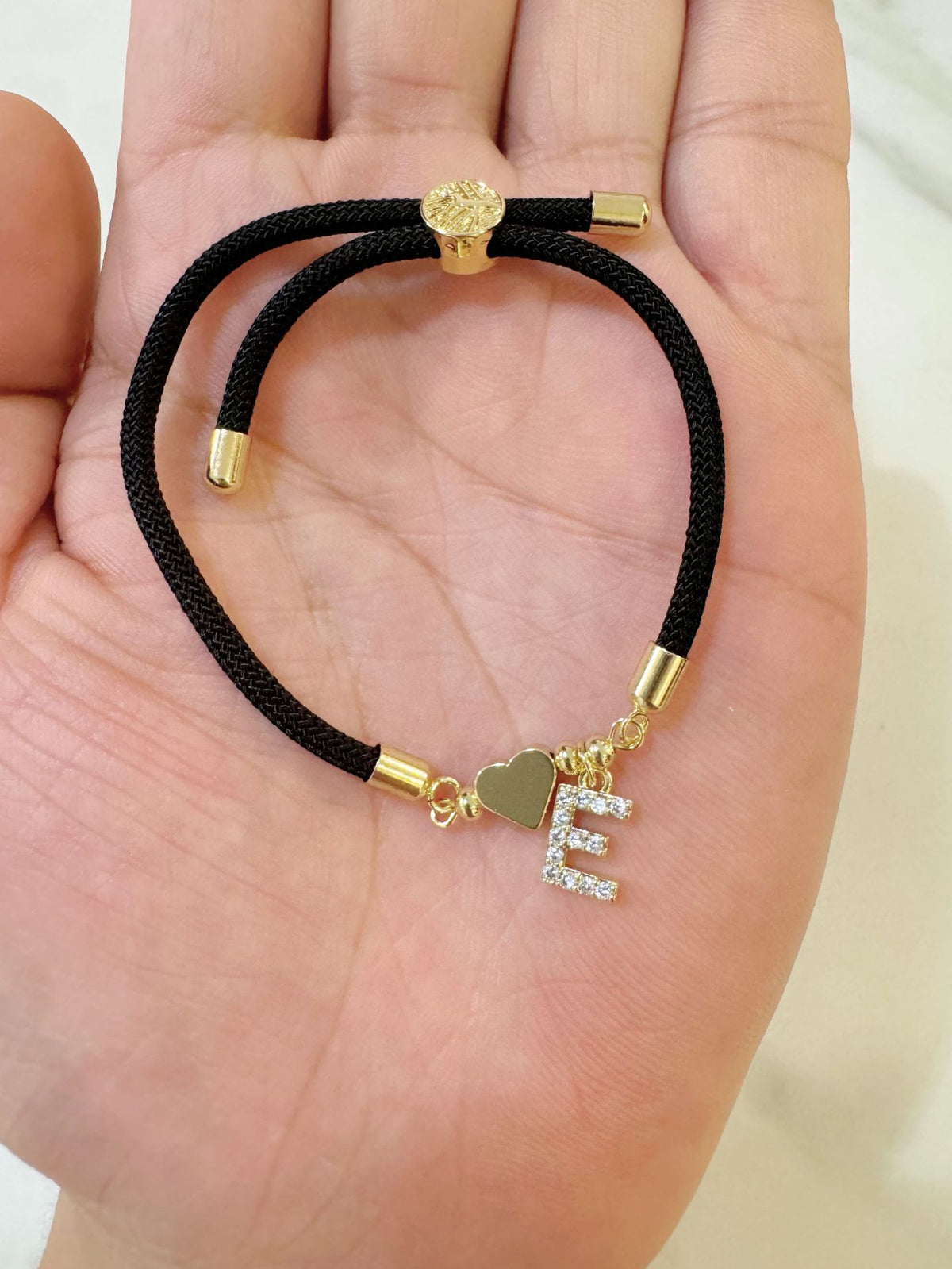 Black initial rope bracelet, letter E