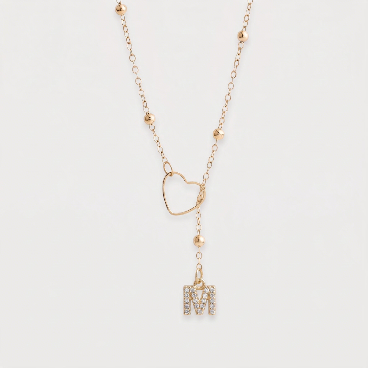 Letter M · gold