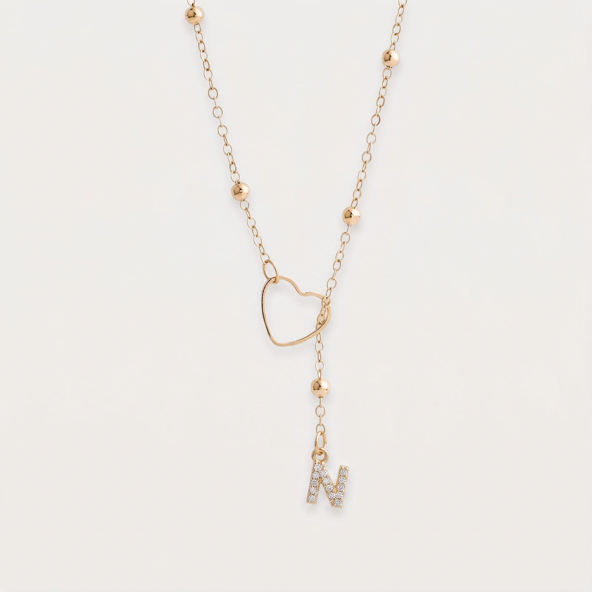 Letter N · gold