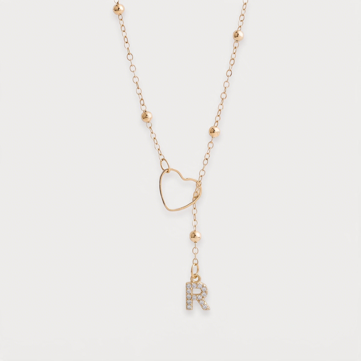 Letter R · gold