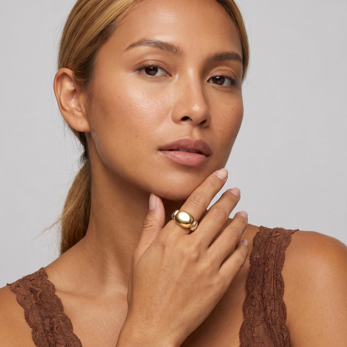 Geometric Oval Cross Ring worn by a model