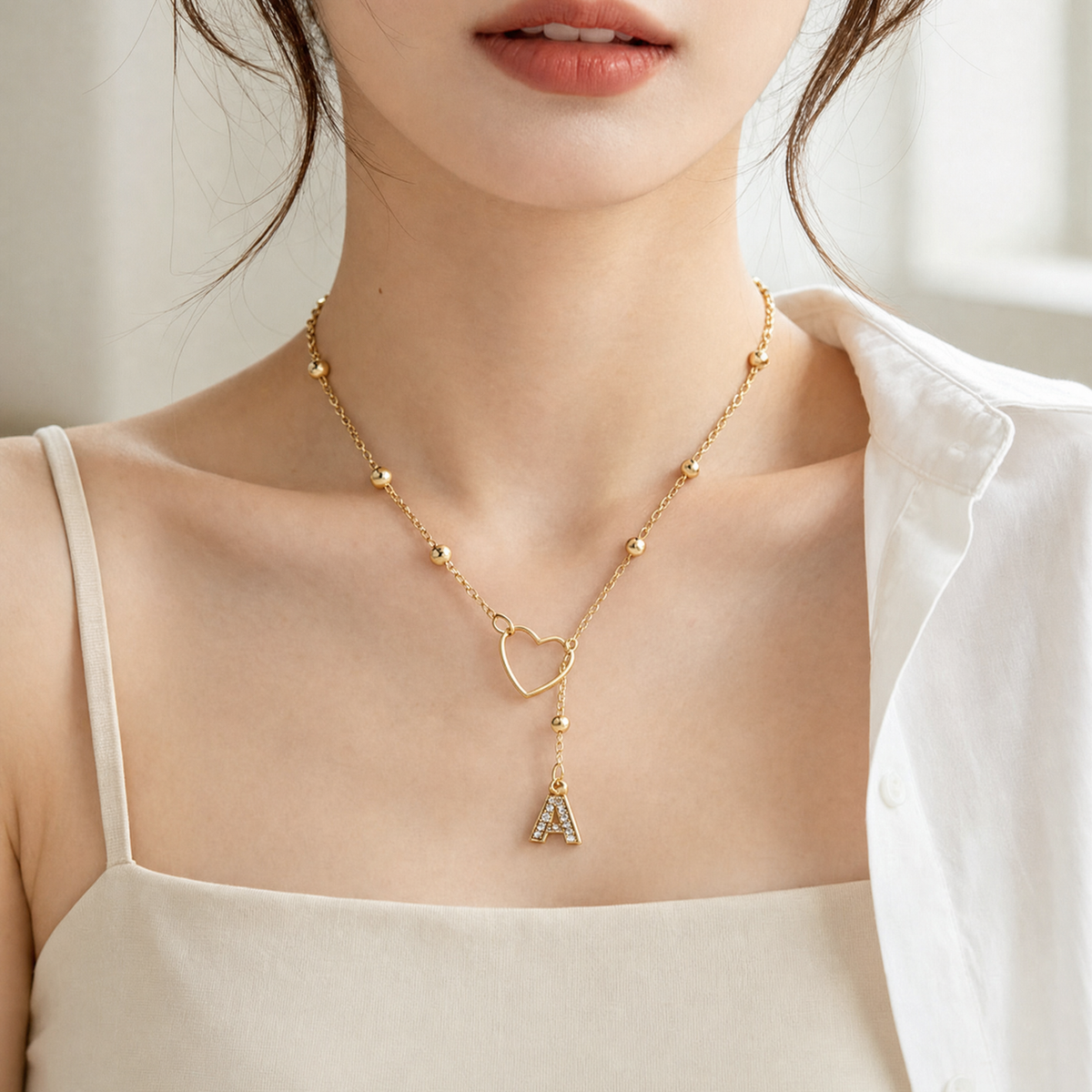 Drop initial necklace worn