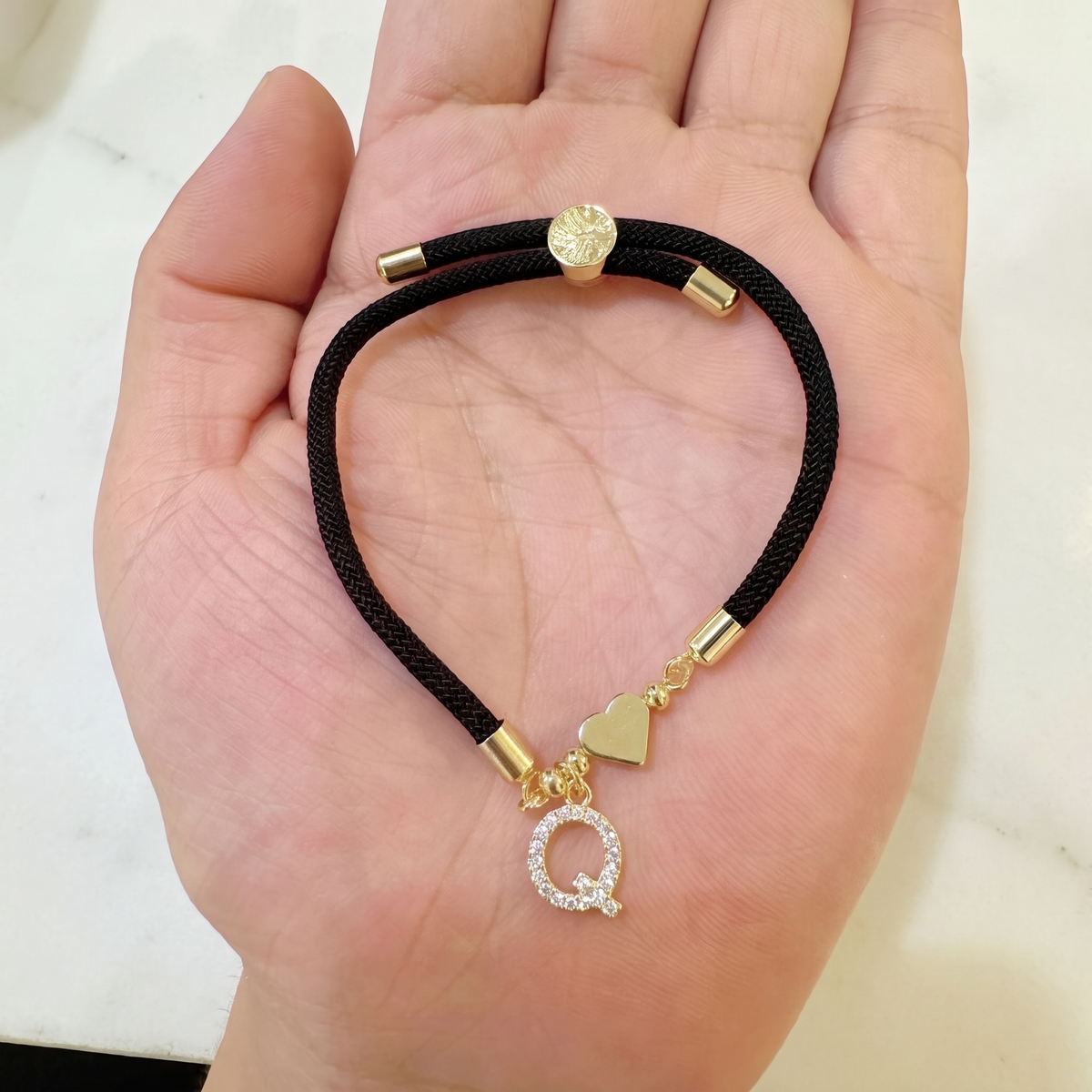 Black initial rope bracelet, letter Q