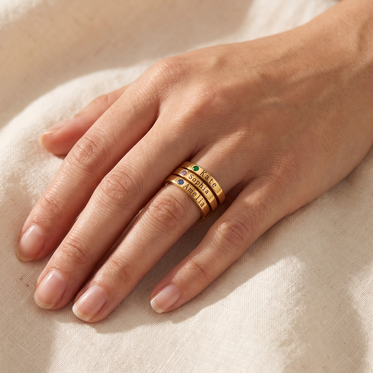 Gold loved ones birthstone rings worn