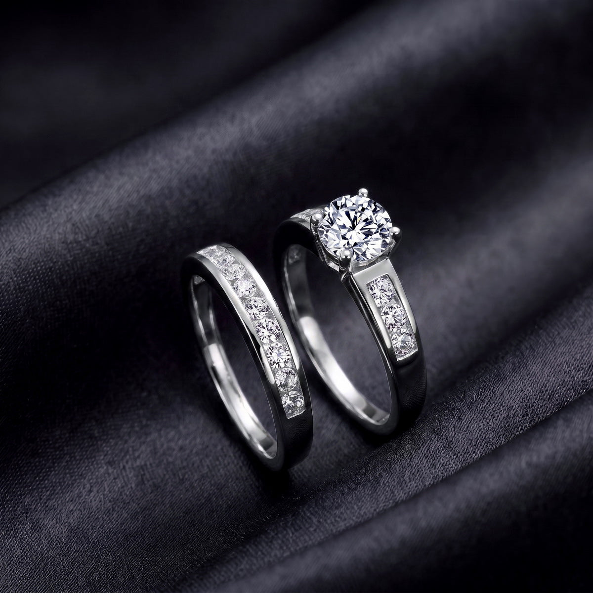 Both rings on dark satin