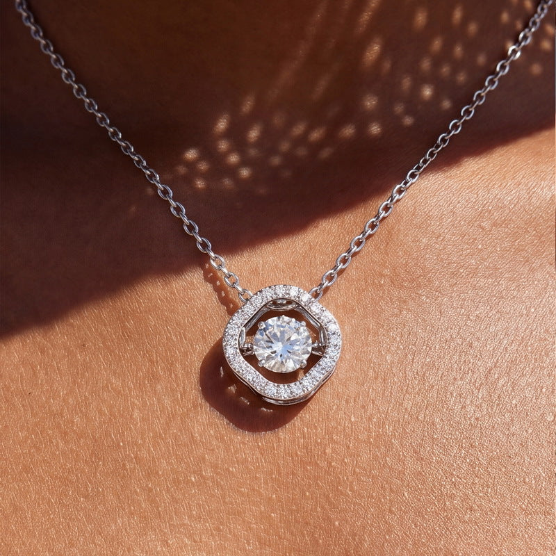 The dancing clover necklace in sunlight