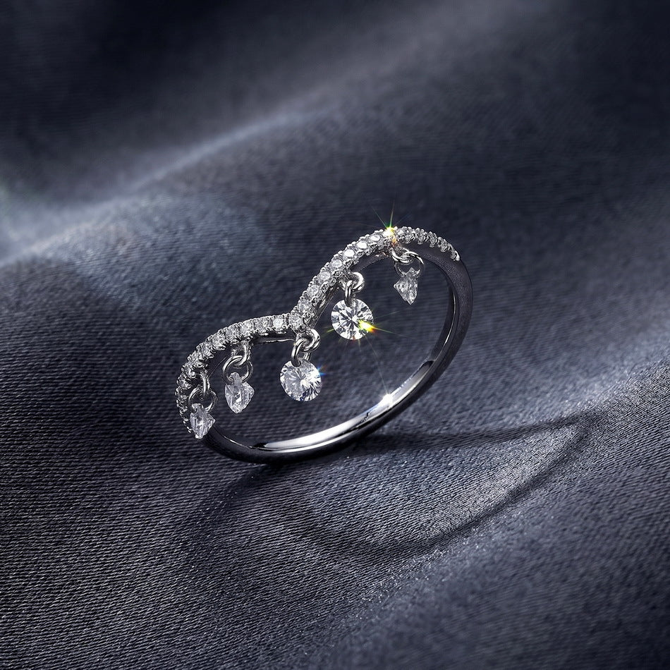 Dangle chevron ring on dark satin