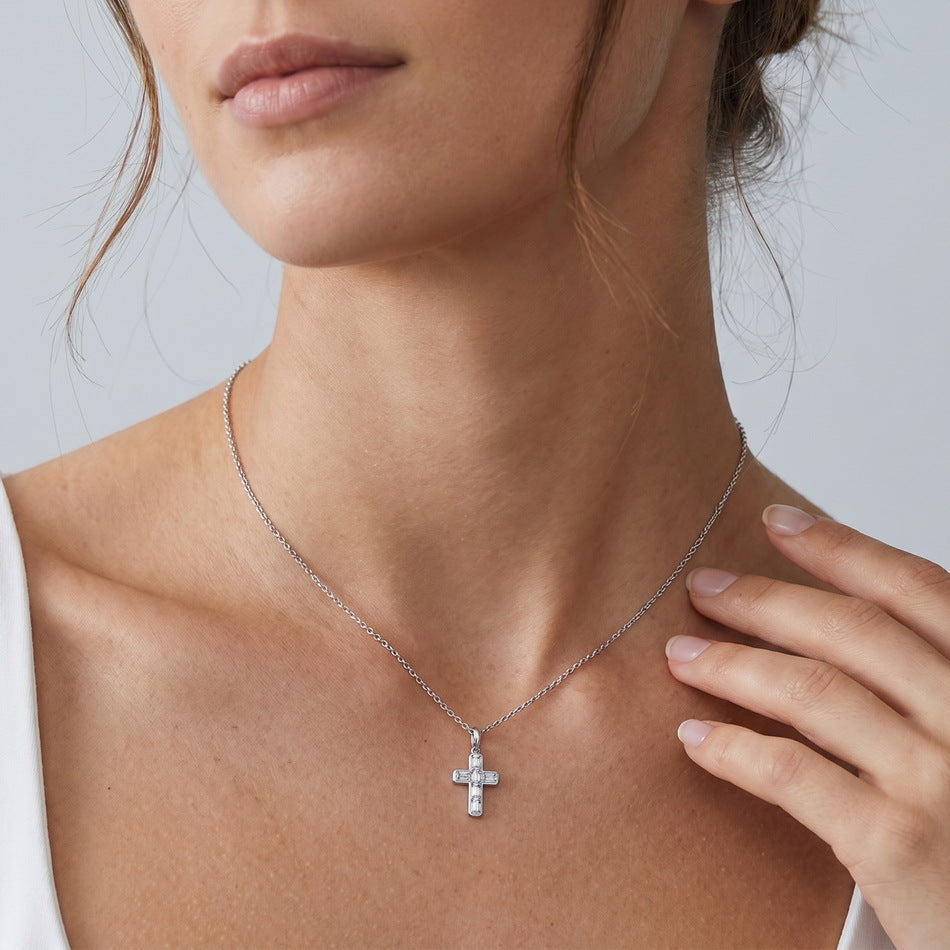 Model wearing the emerald cross necklace