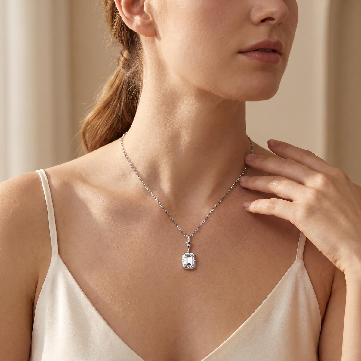 Model wearing the emerald drop pendant