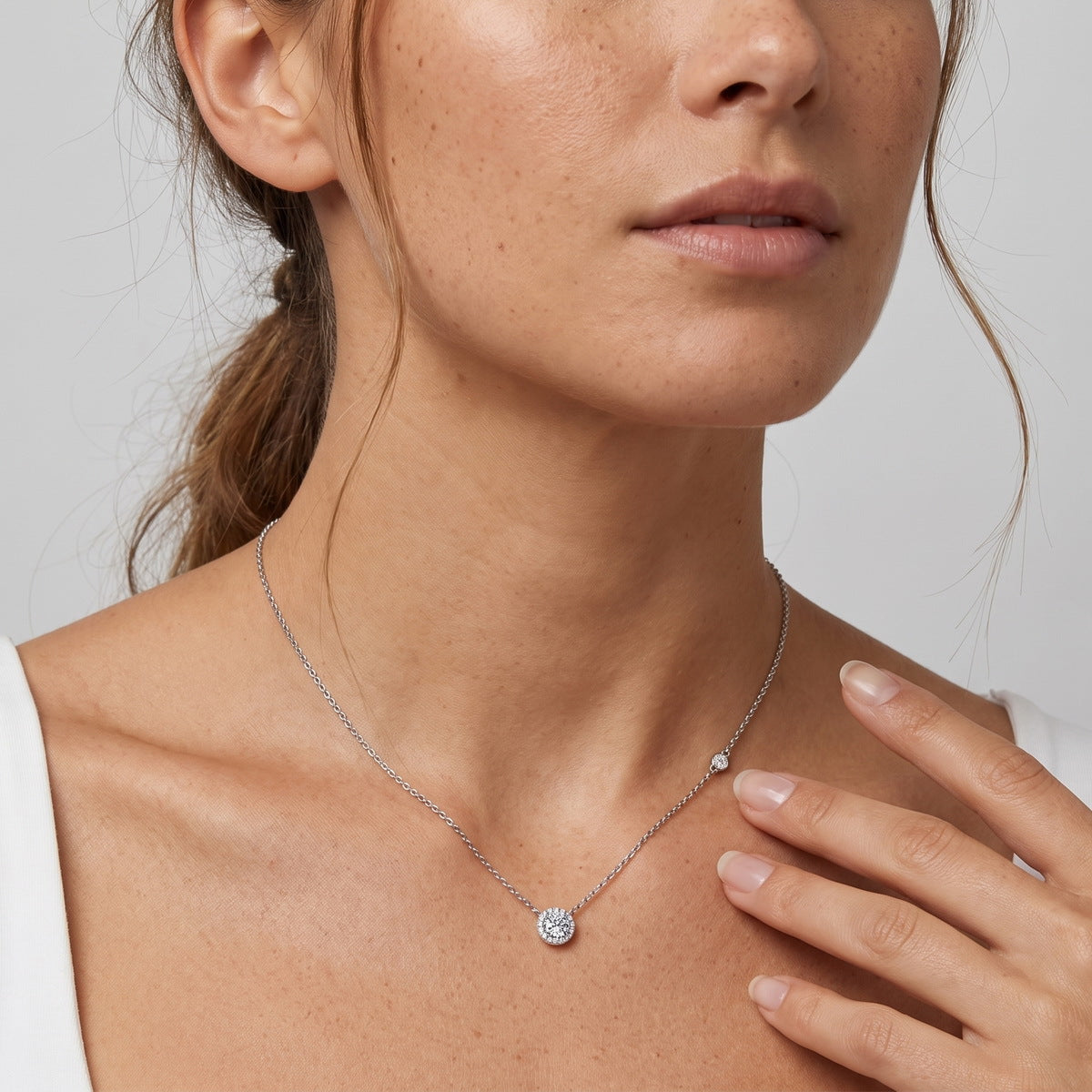 Model wearing the halo station necklace