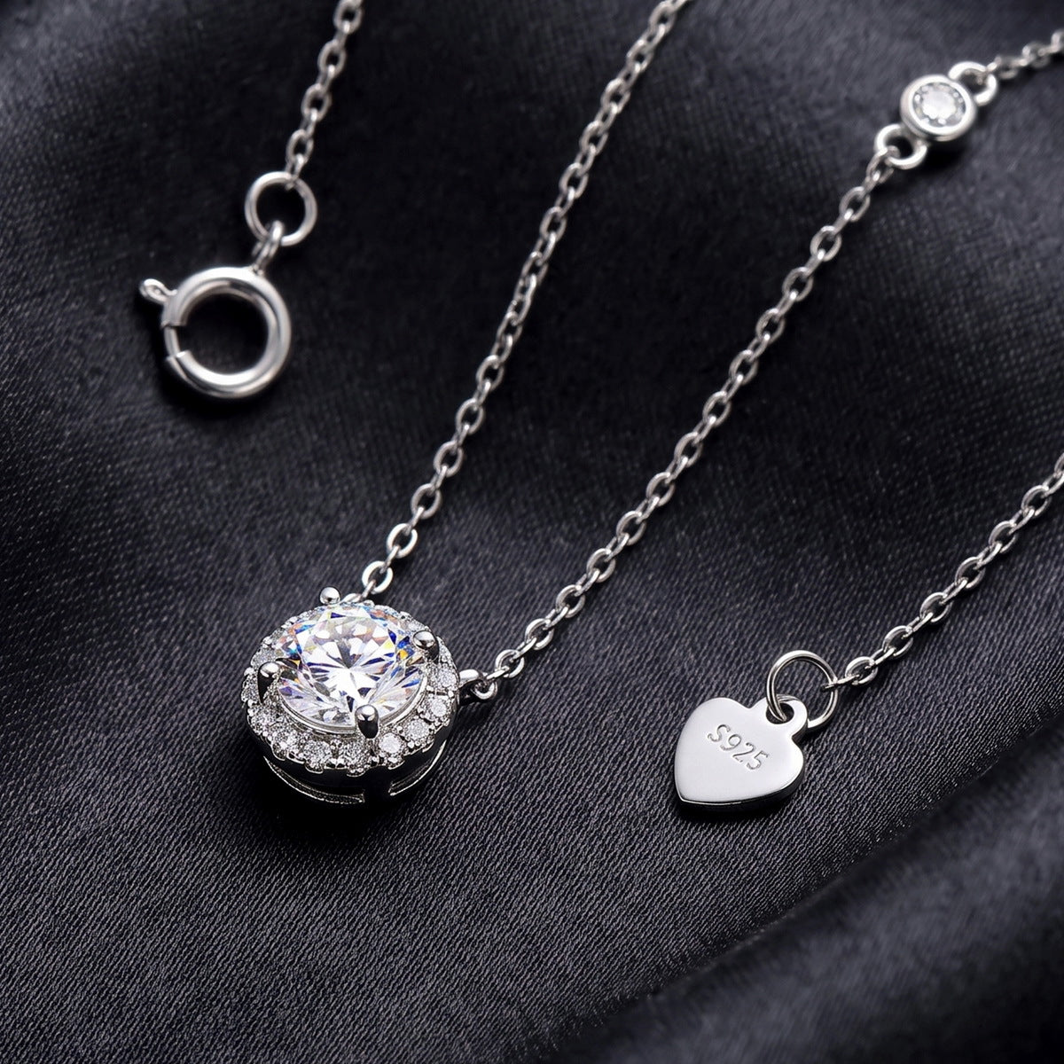 On dark satin with the heart tag