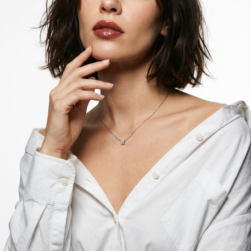 Model wearing the marquise butterfly necklace