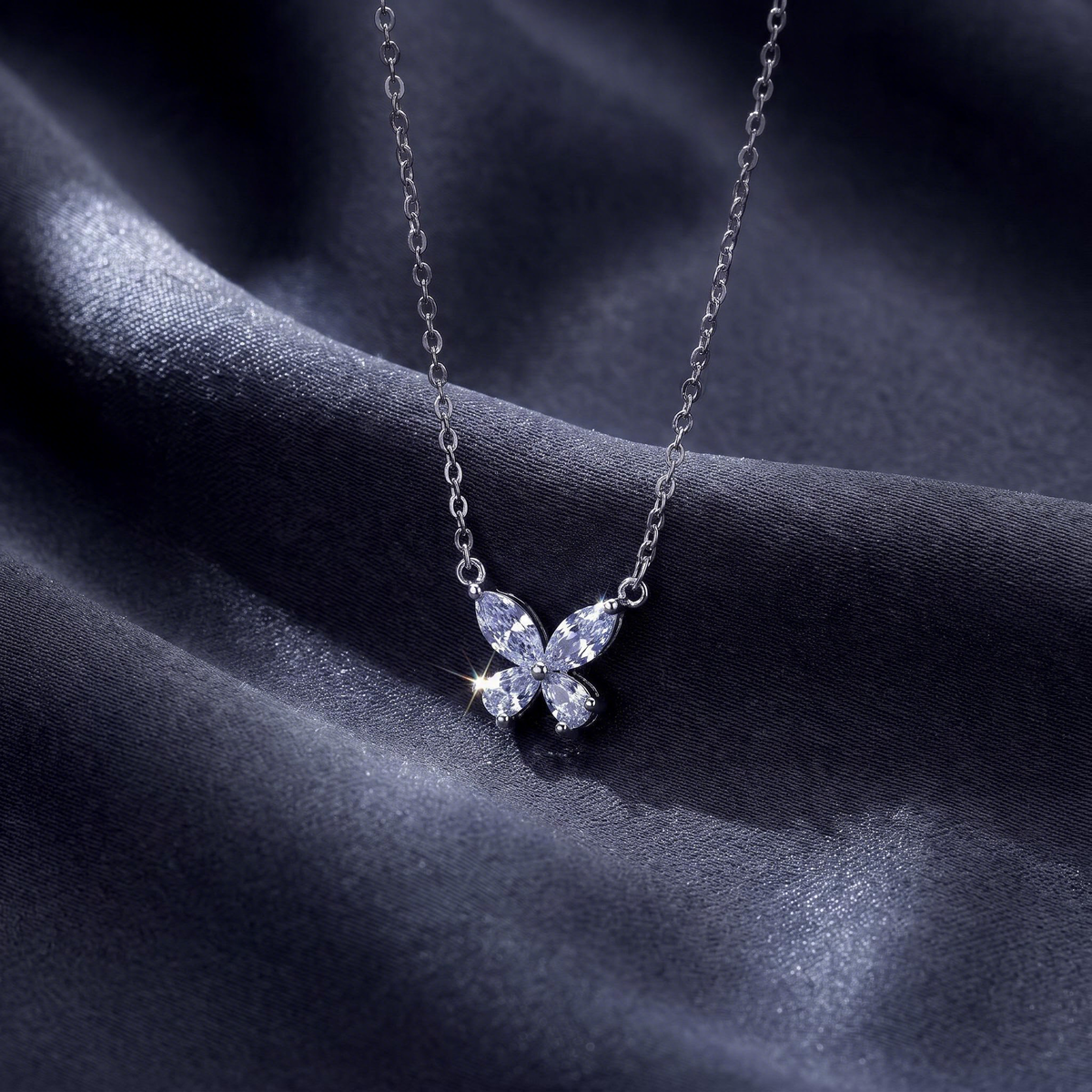 Marquise butterfly necklace laid flat