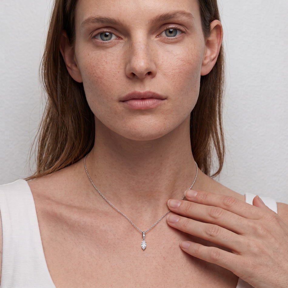 Model wearing the marquise solitaire drop pendant