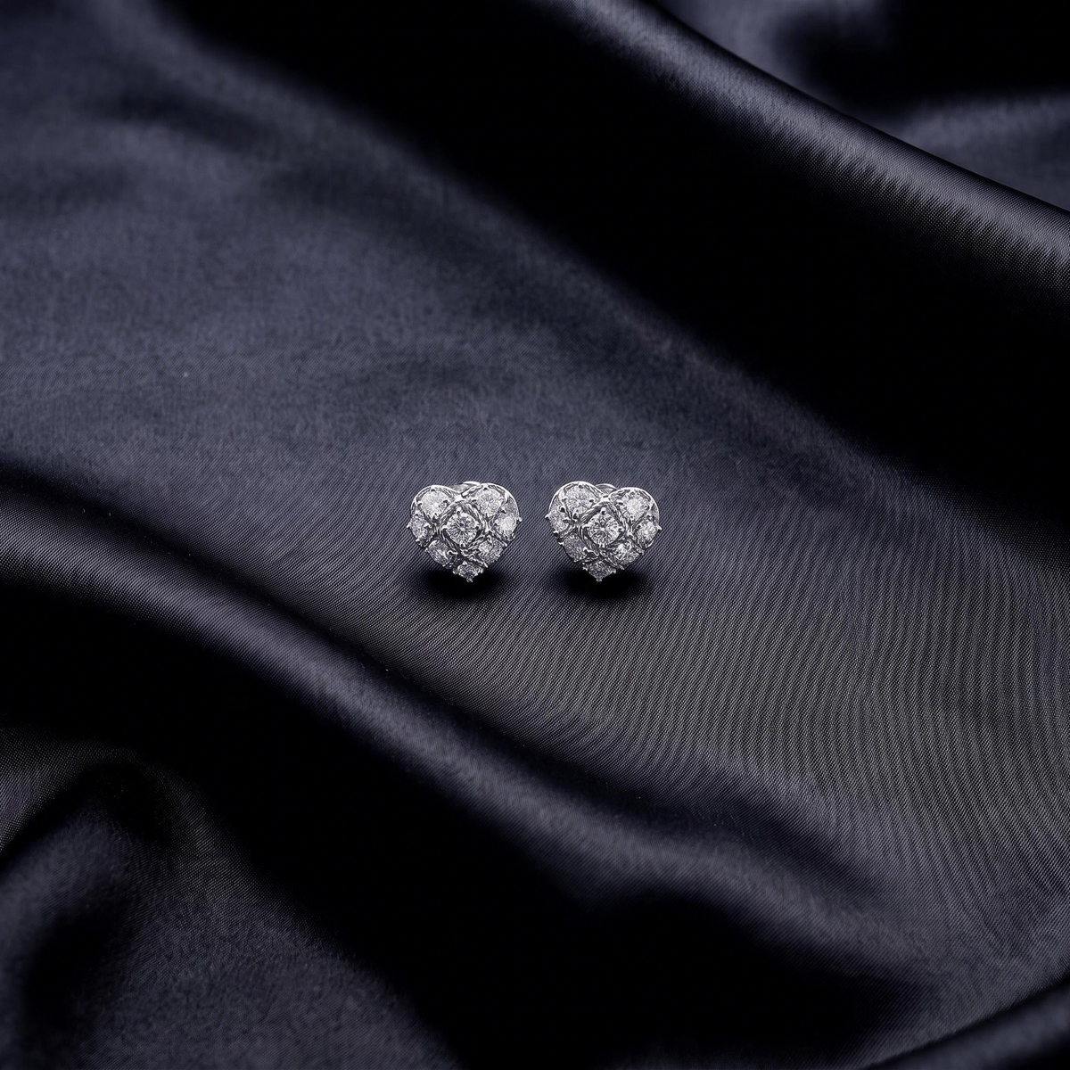Mini heart studs on satin, close up