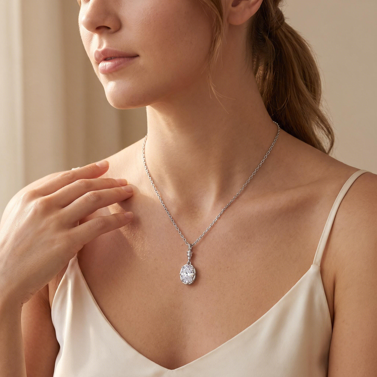 Model wearing the oval drop pendant