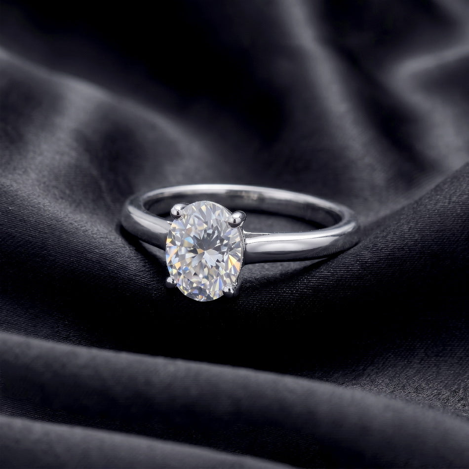Oval solitaire on dark satin