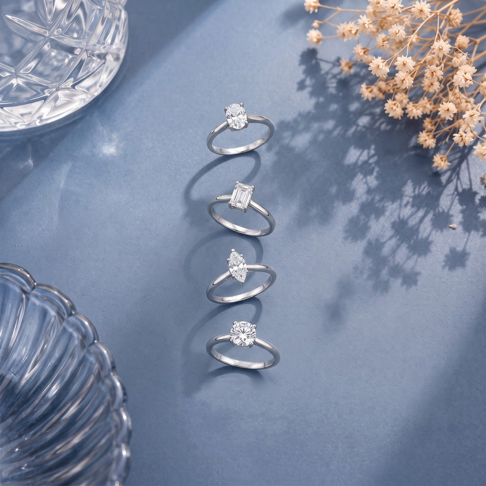 Solitaires in four shapes on blue linen