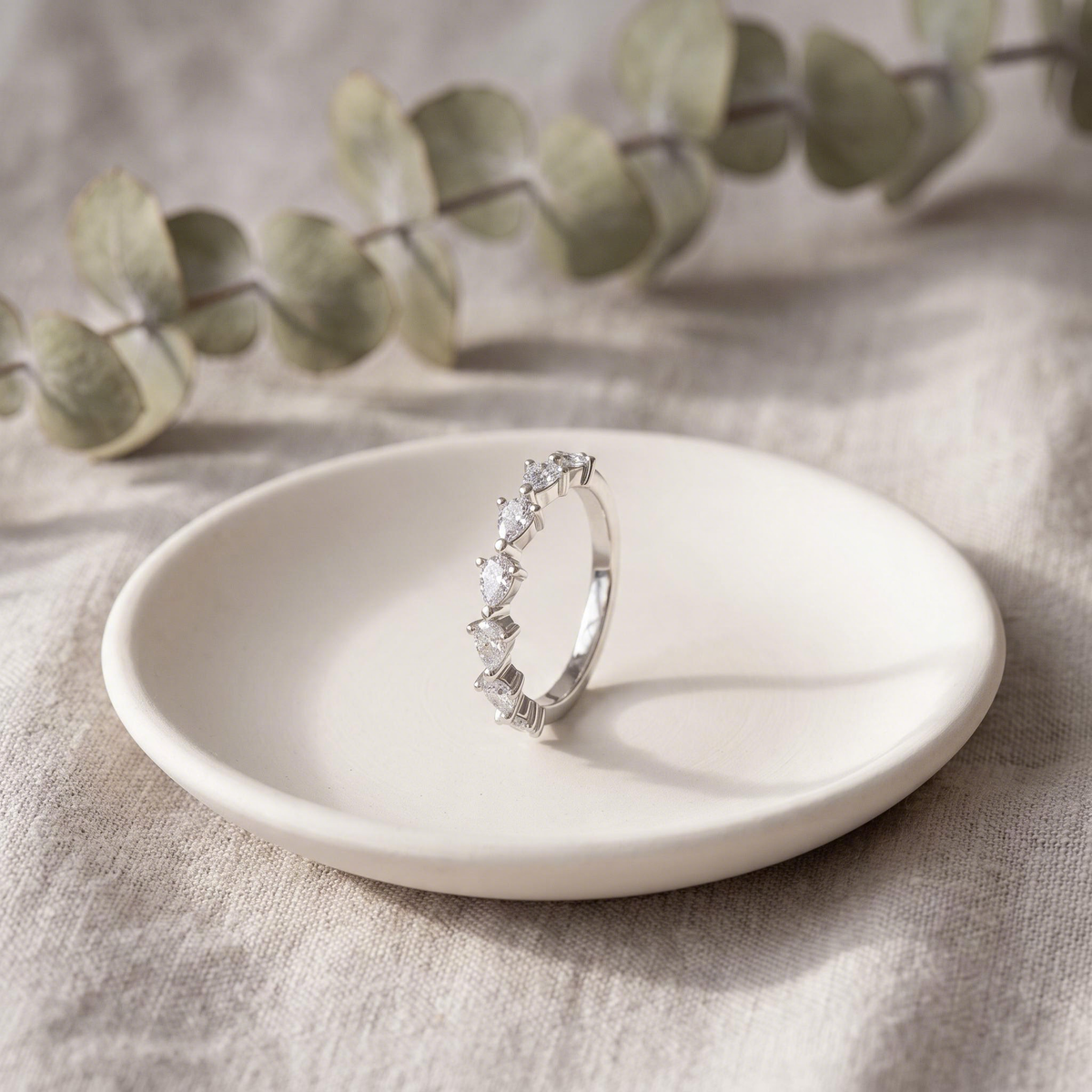 In a ceramic dish on linen