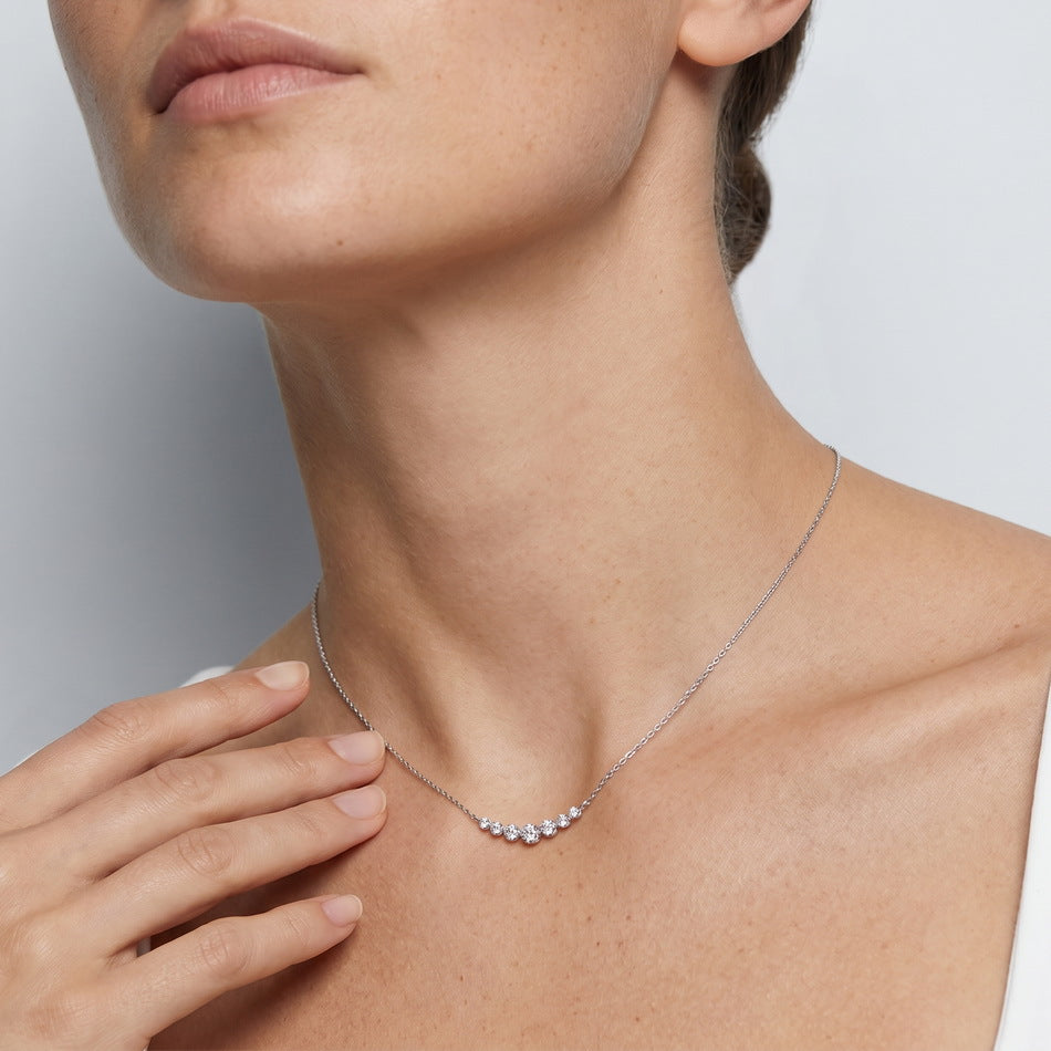 Model wearing the seven-stone smile necklace