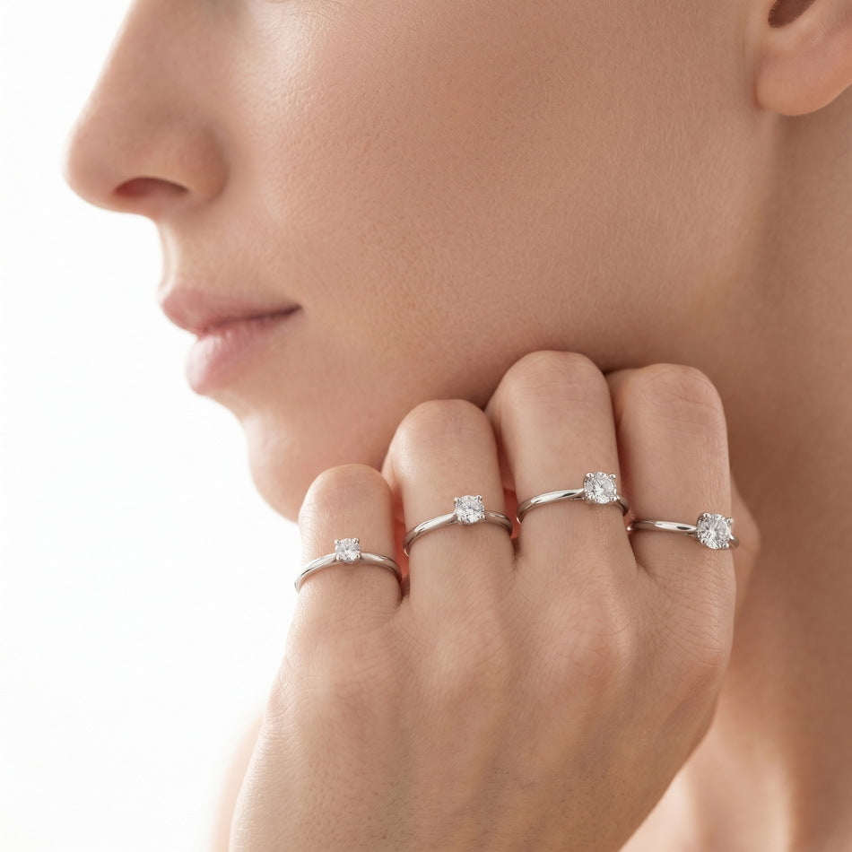 Solitaire rings worn across the fingers