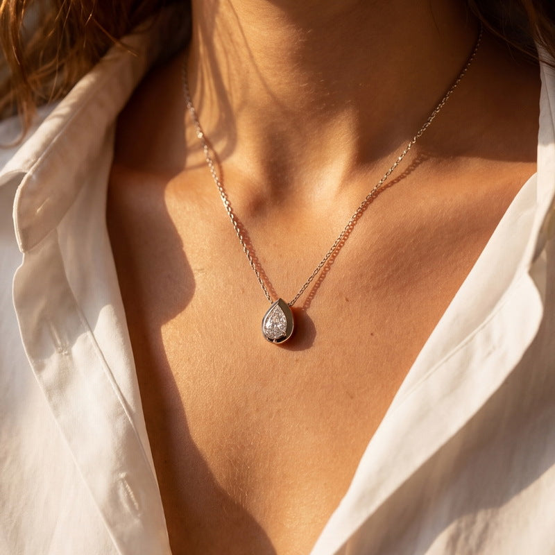 Model wearing the teardrop bezel necklace