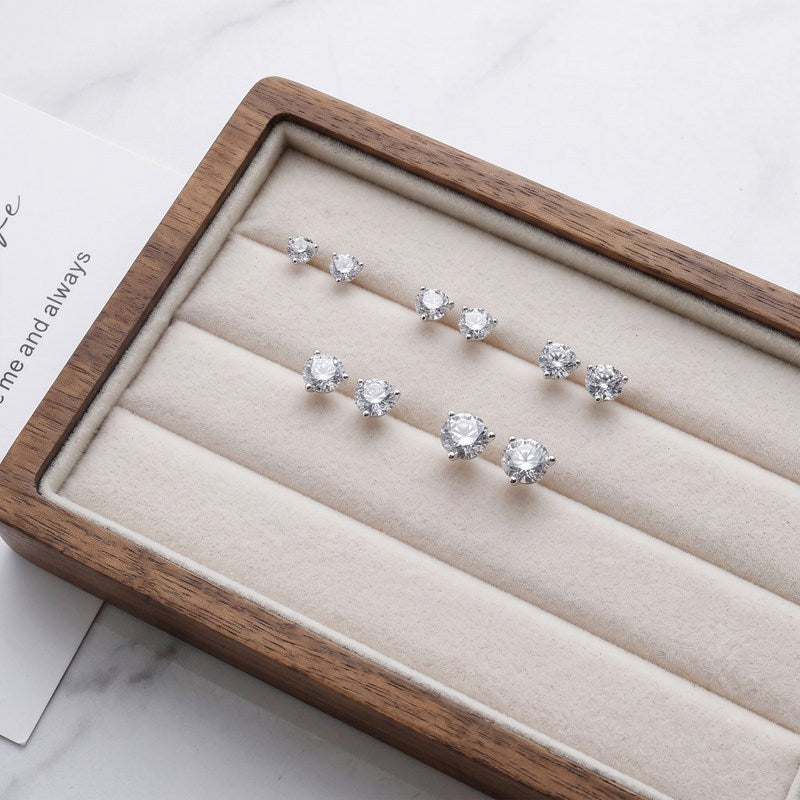 Studs in a walnut tray (several sizes shown)