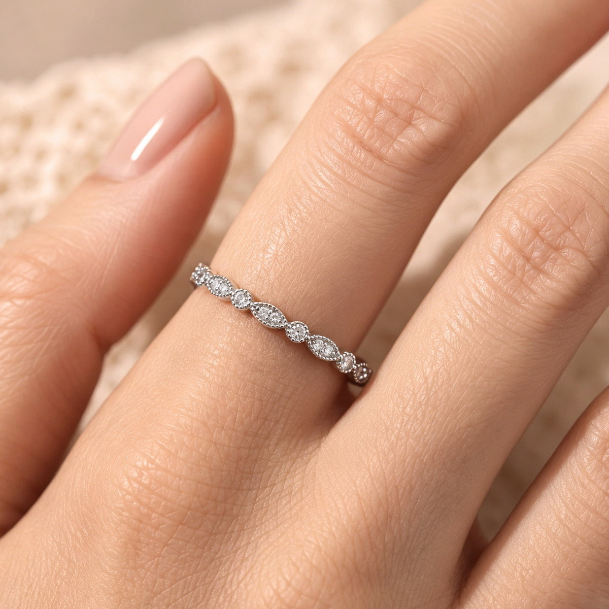 The milgrain band on the hand