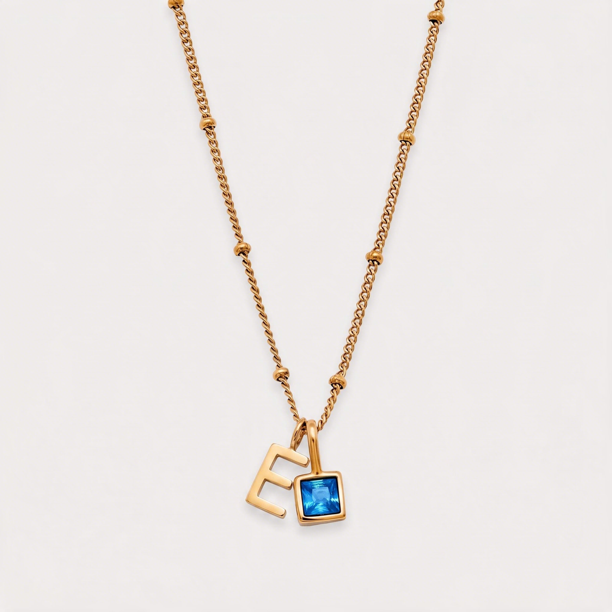 Letter E · gold