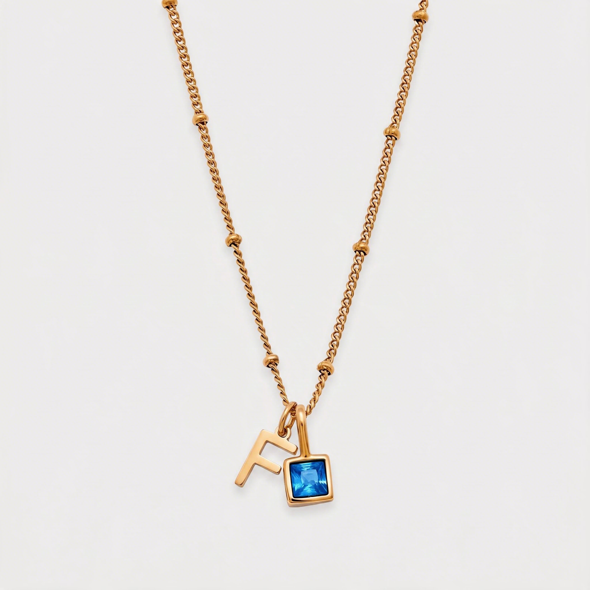 Letter F · gold