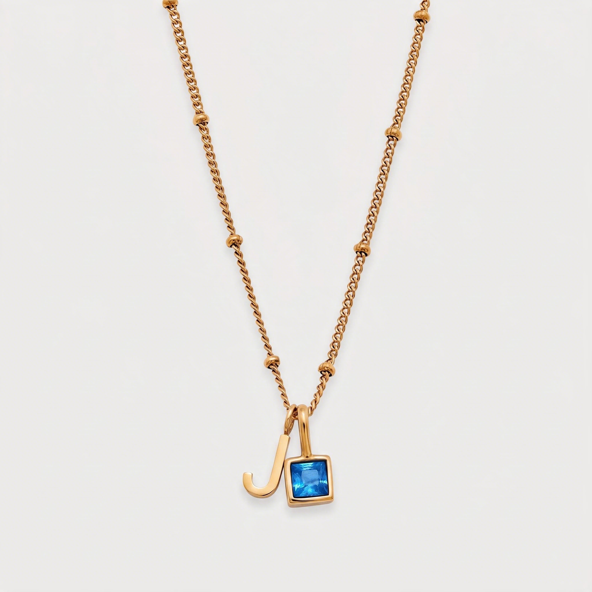 Letter J · gold