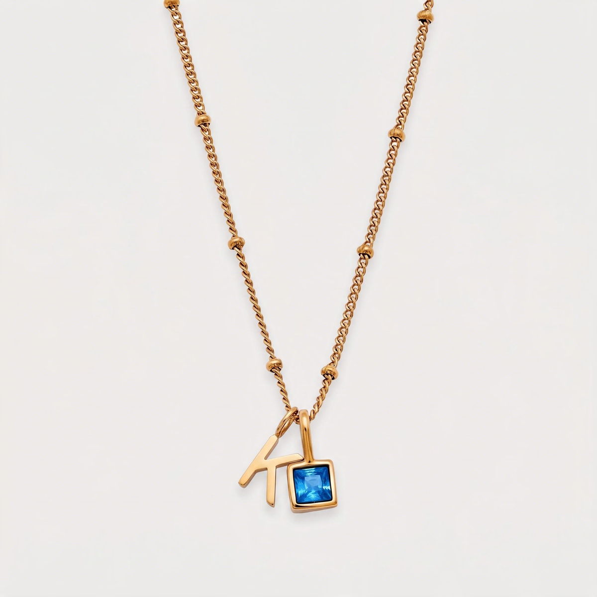 Letter K · gold