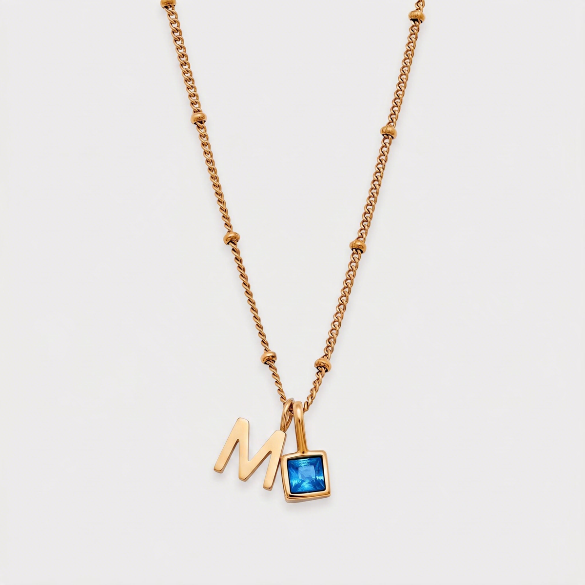 Letter M · gold
