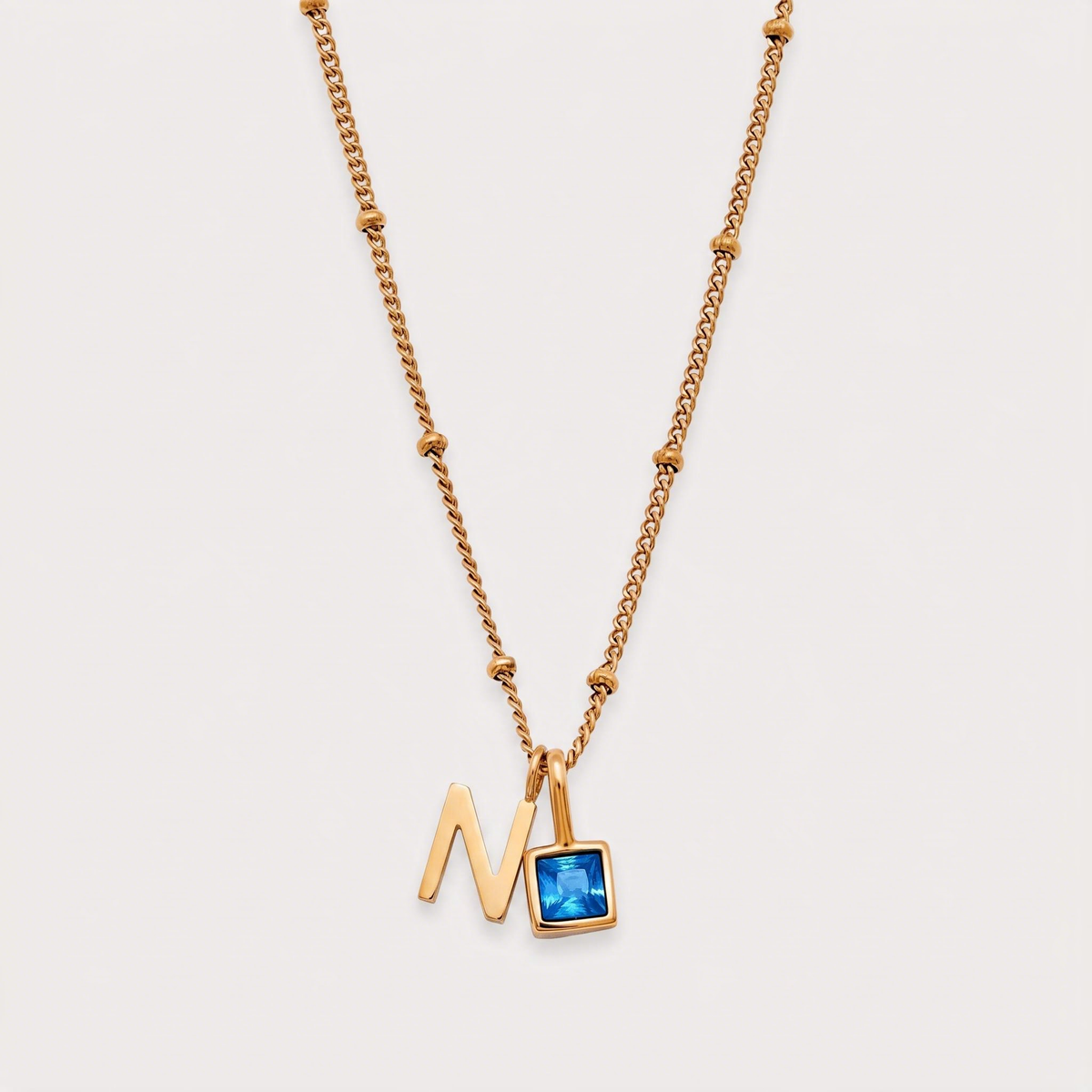 Letter N · gold
