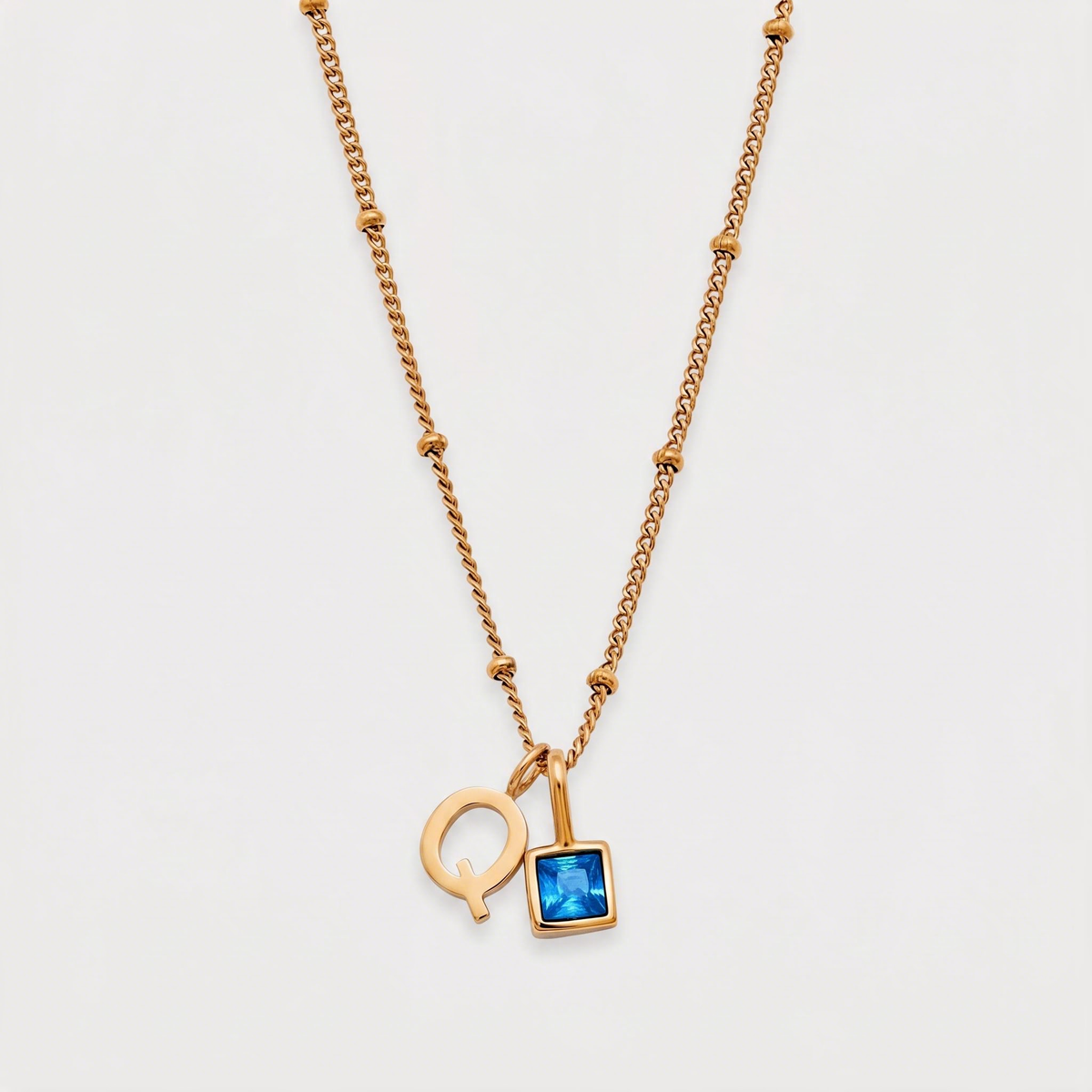 Letter Q · gold
