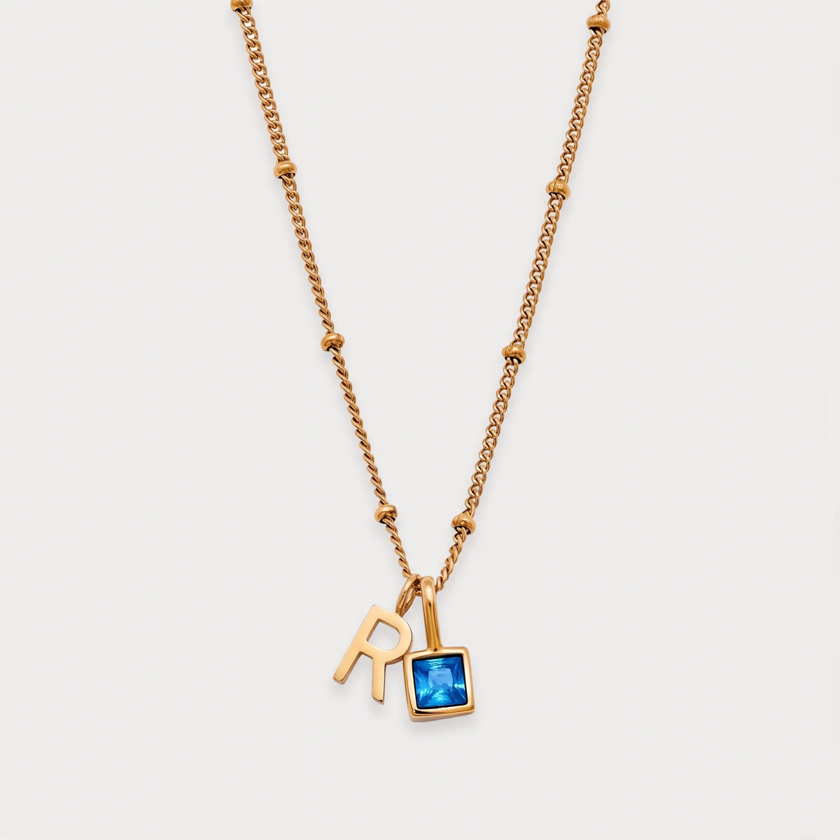 Letter R · gold