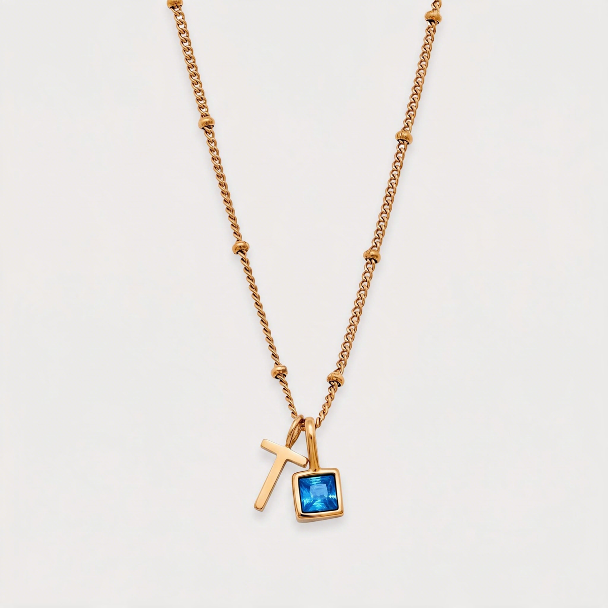 Letter T · gold