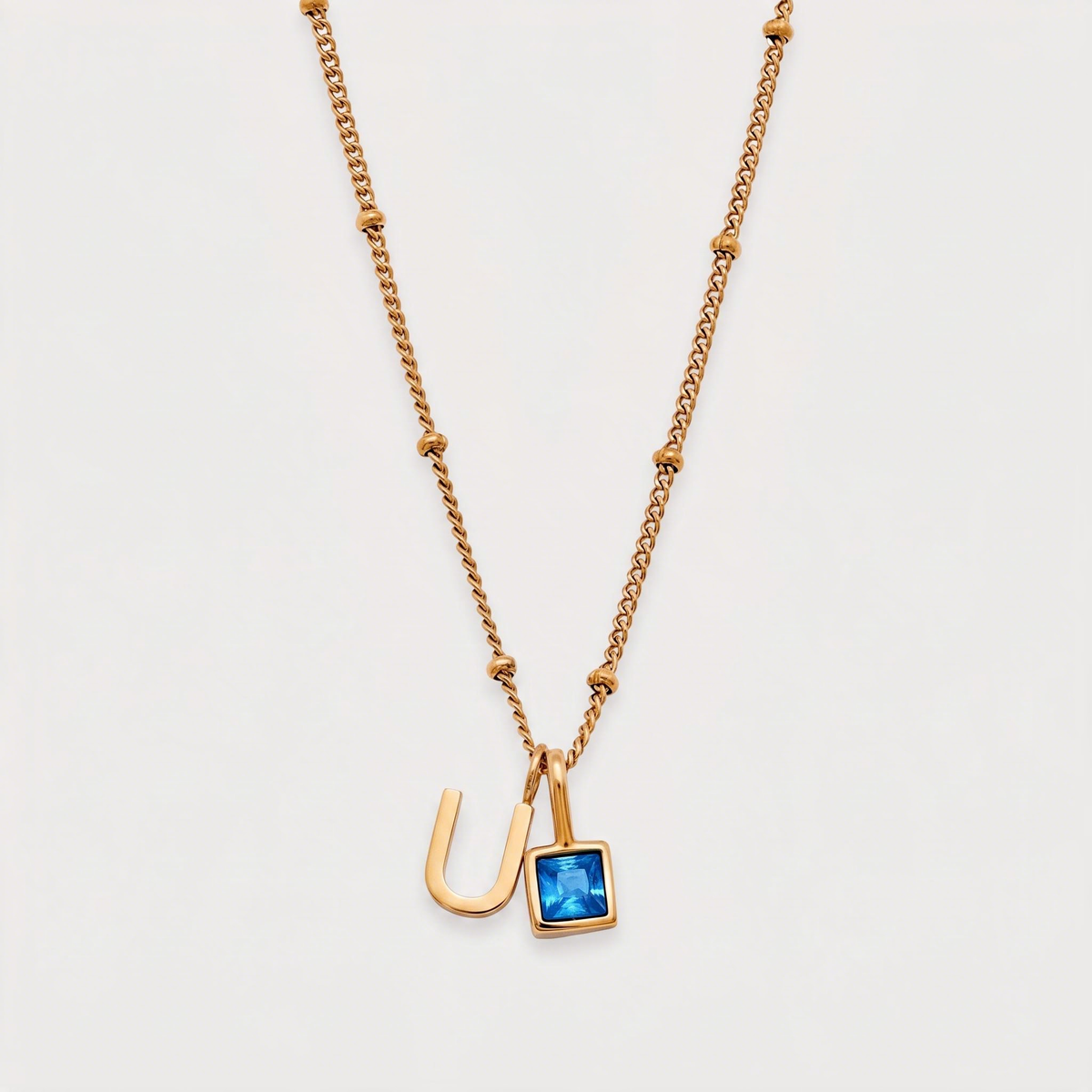 Letter U · gold