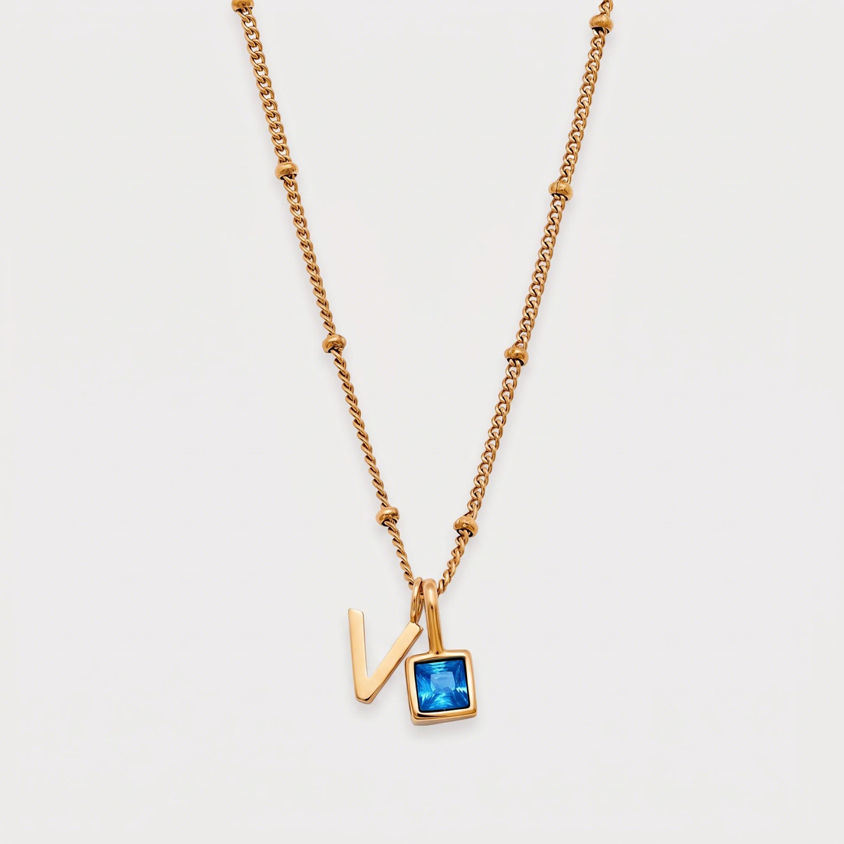 Letter V · gold