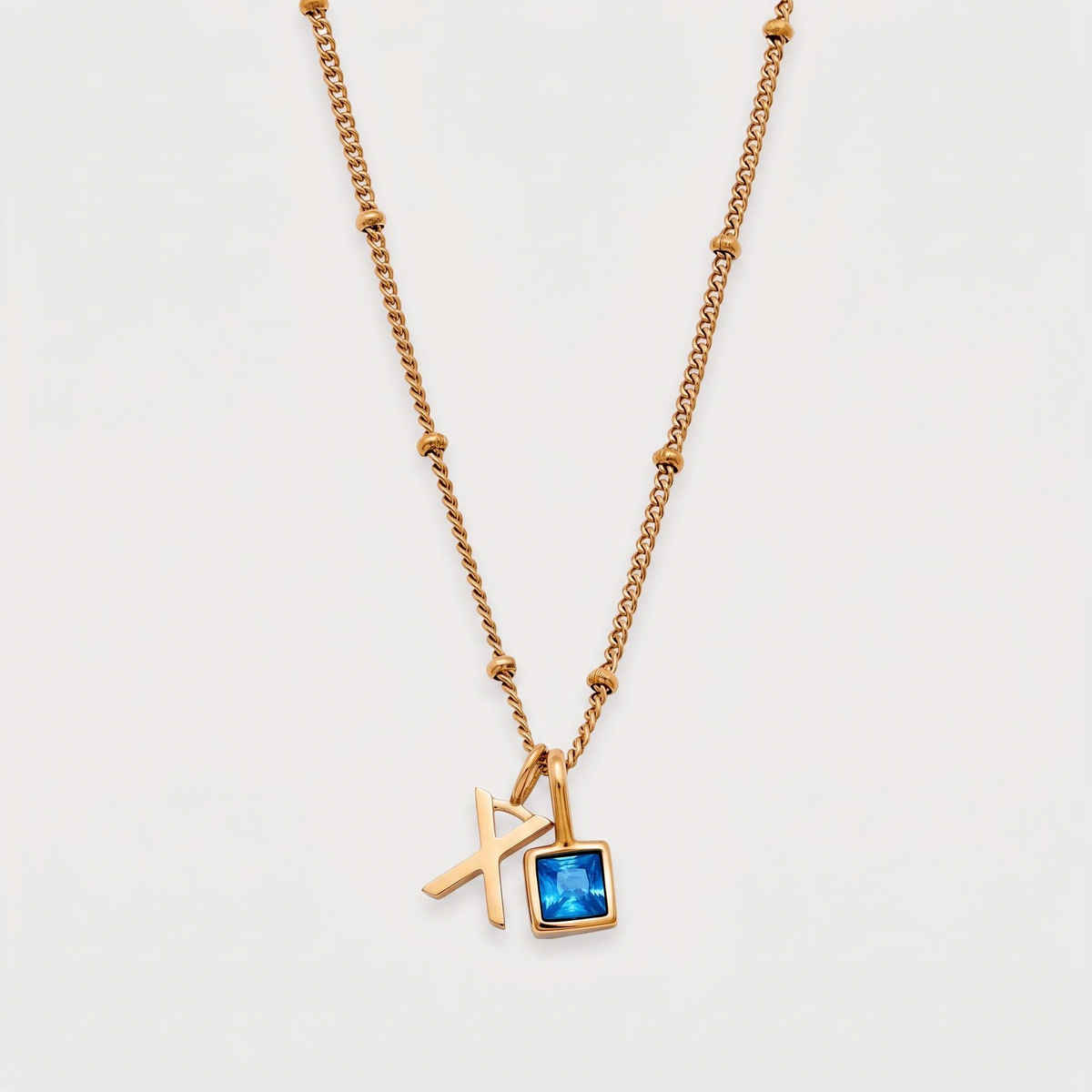 Letter X · gold