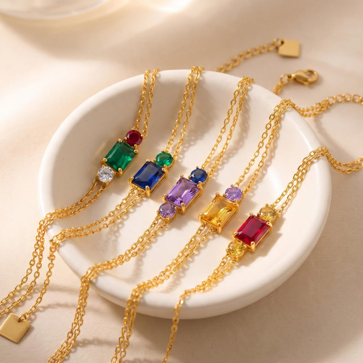 Two-Stone Birthstone Bracelets in a ceramic dish